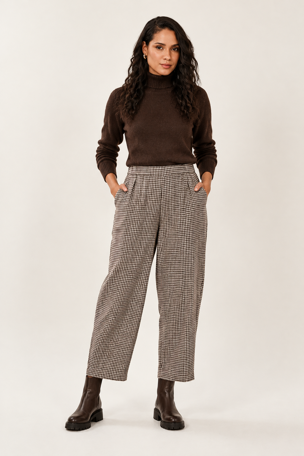 Checked trousers styled with a chocolate-brown roll neck and chunky boots