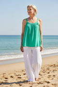 Turquoise Green Top with White Trousers on Older Model